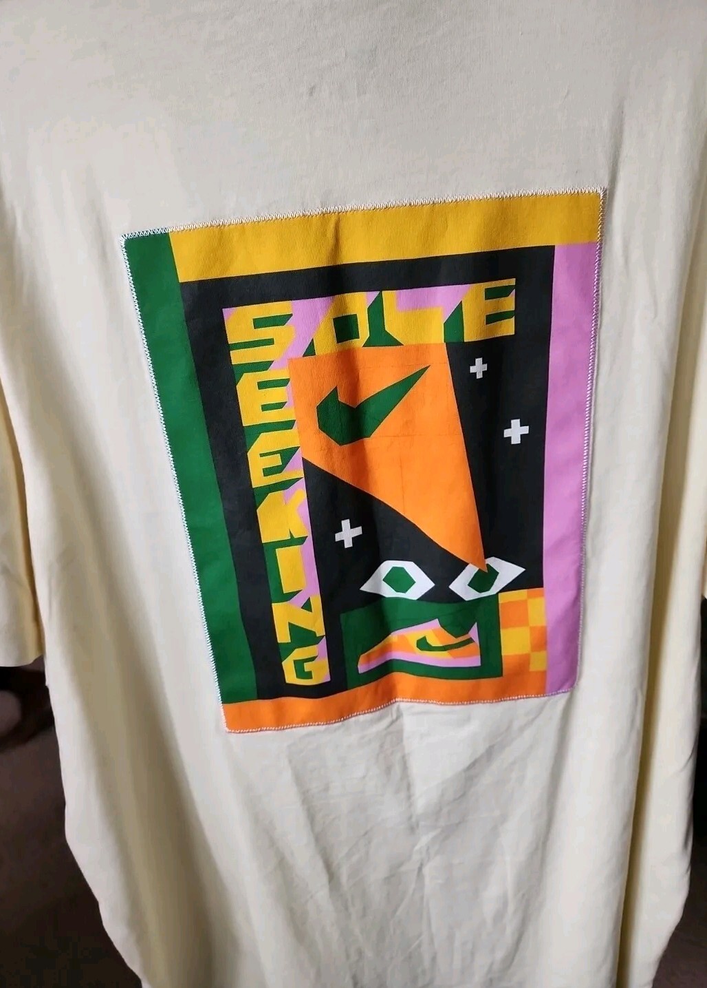 The NIKE  Logo Tee  Size XXL. Beige With Multi Color Graphic. New